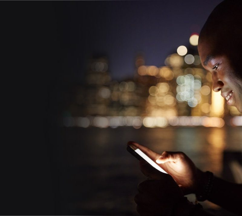 Gentleman on his phone outside at night