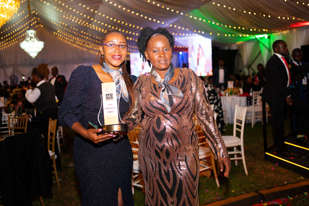 2 Beautiful Madison agents all elegant at the AKI awards gala dinner holding their award